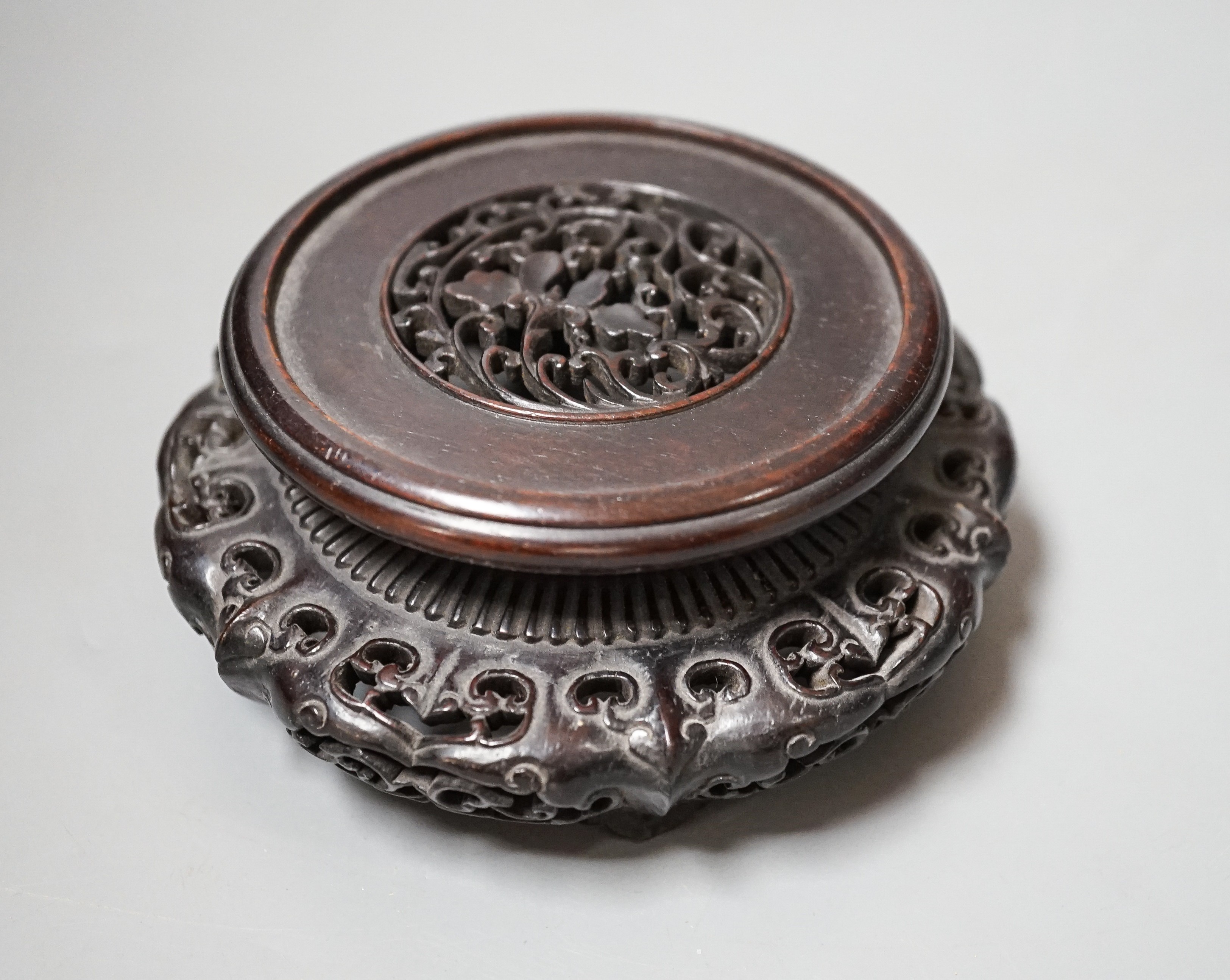 A fine 19th century Chinese hardwood stand, 11.4cm diameter